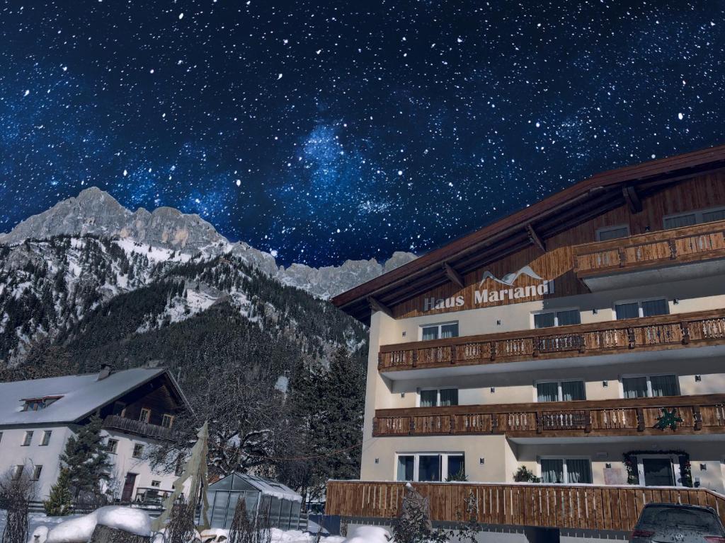 a hotel at night with a star filled sky at Haus Mariandl in Nesselwängle