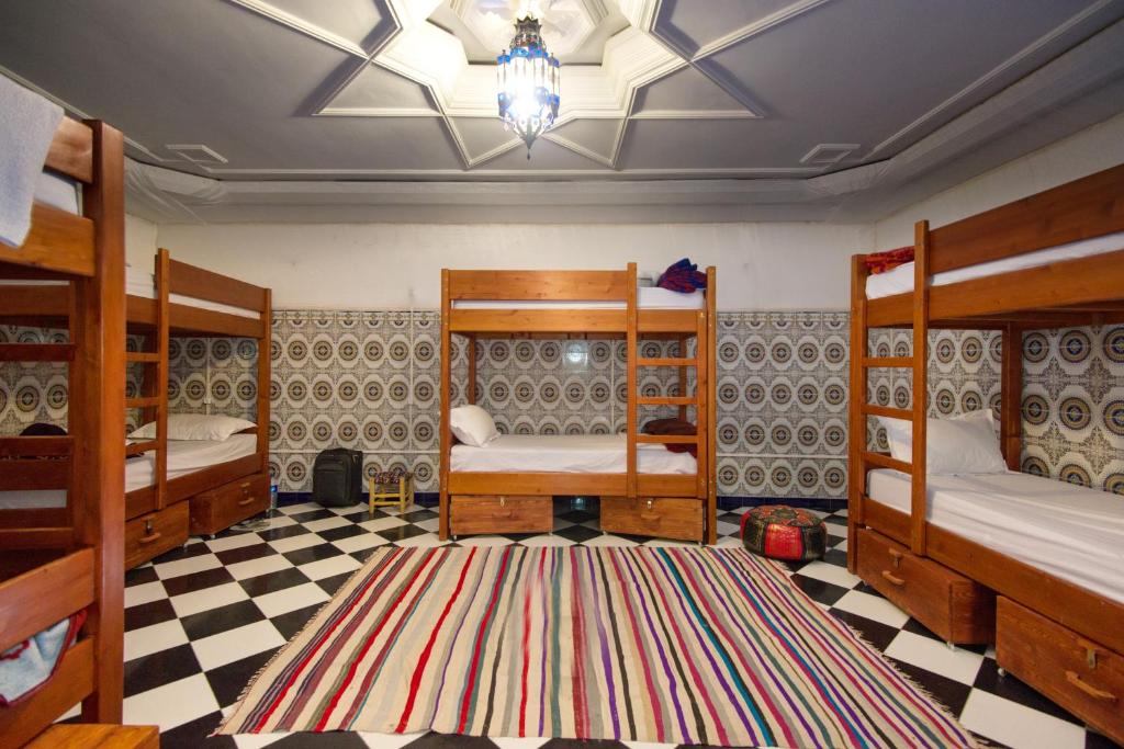 Postel nebo postele na pokoji v ubytování Mosaic Hostel
