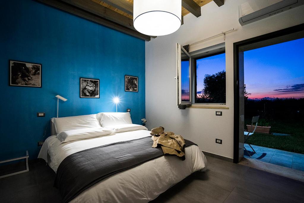 Postel nebo postele na pokoji v ubytování La Casa di Raffaele