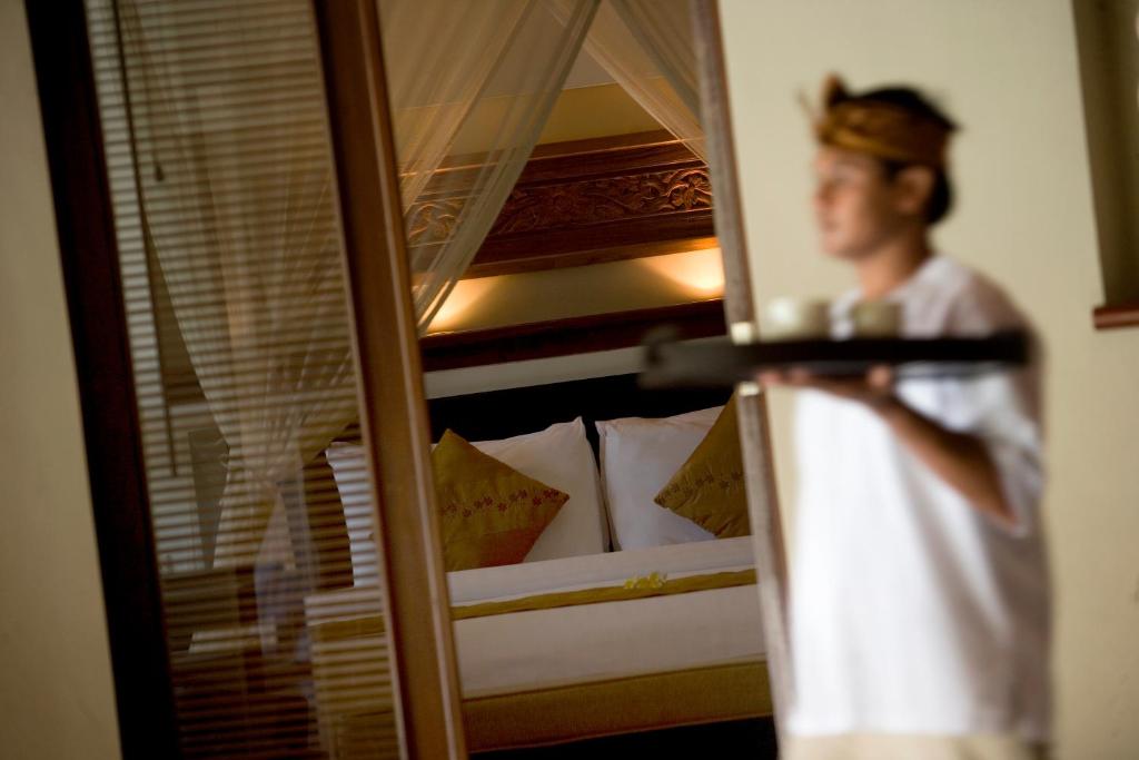 Postel nebo postele na pokoji v ubytování The Kunja Villa-Hotel