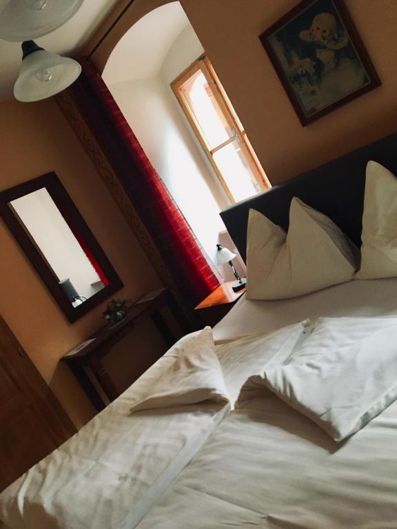 Postel nebo postele na pokoji v ubytování Pension & Restaurant Atmosféra