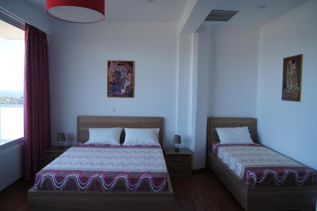 Postel nebo postele na pokoji v ubytování Calypso Apartments