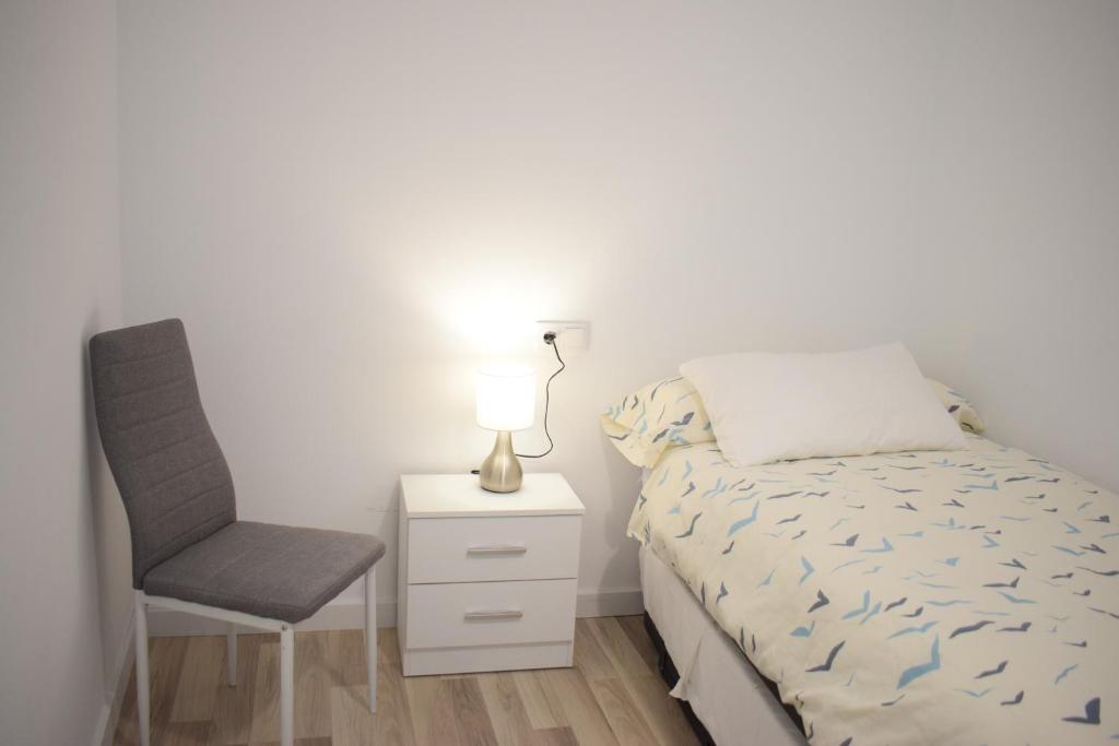 Postel nebo postele na pokoji v ubytování Wallada Damasco
