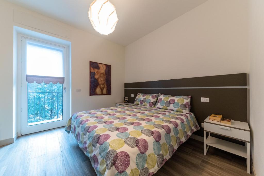 Postel nebo postele na pokoji v ubytování parina Inn – Locanda
