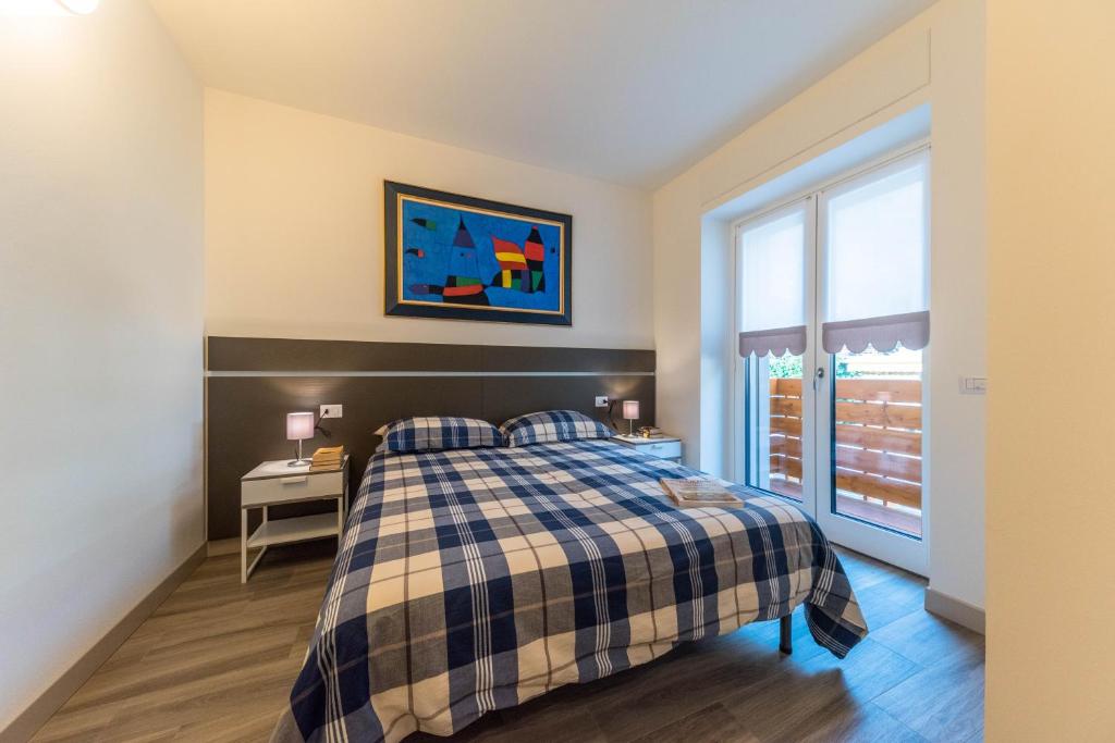 Postel nebo postele na pokoji v ubytování parina Inn – Locanda