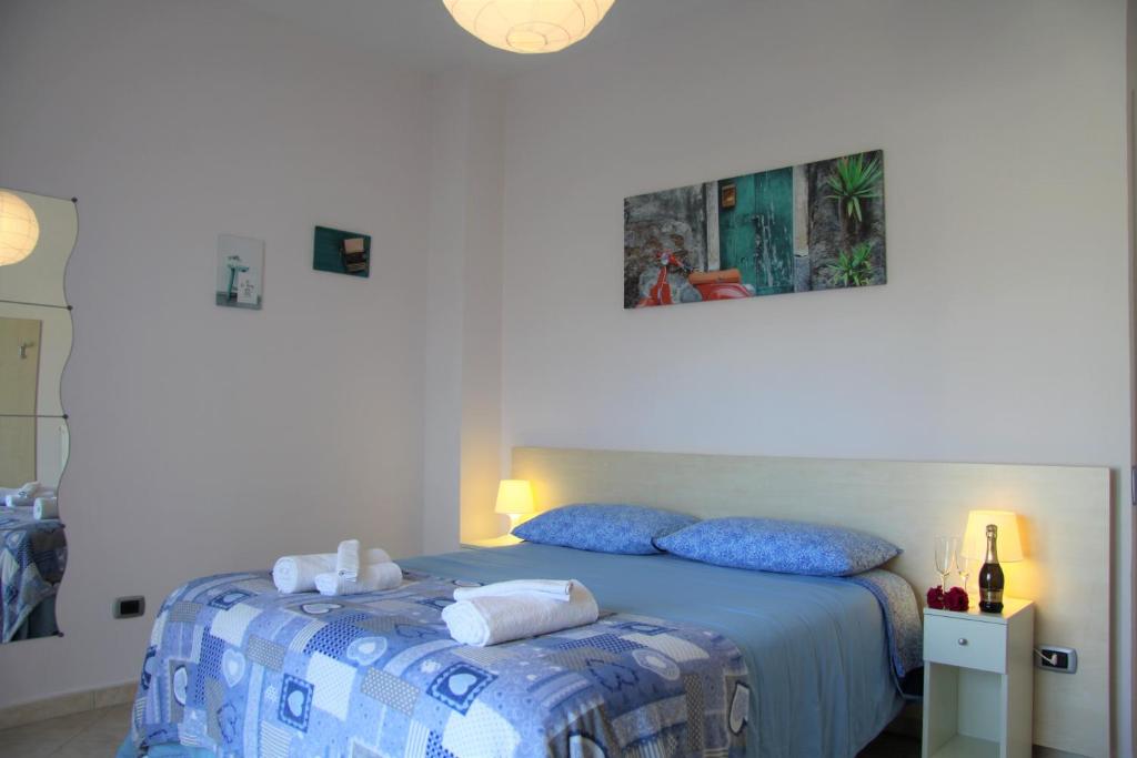 Postel nebo postele na pokoji v ubytování Zefiro B&B
