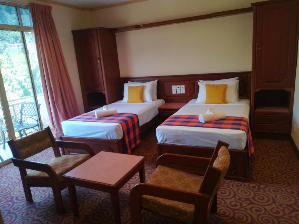 Postel nebo postele na pokoji v ubytování Hotel Lakefield