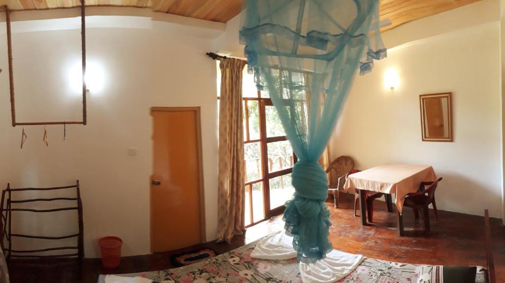 Postel nebo postele na pokoji v ubytování Seasons Four Mini Jungle Cabana