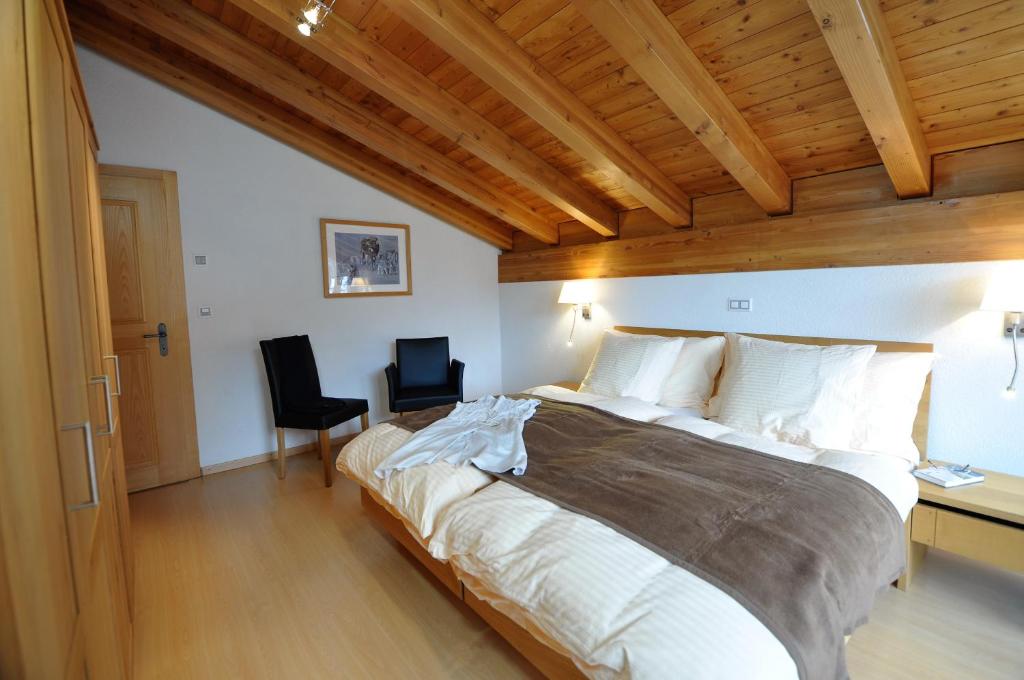 Postel nebo postele na pokoji v ubytování Chalet Z`Wichjehüs