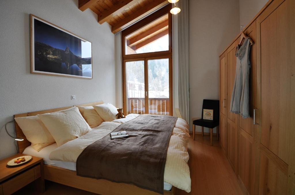 Postel nebo postele na pokoji v ubytování Chalet Z`Wichjehüs
