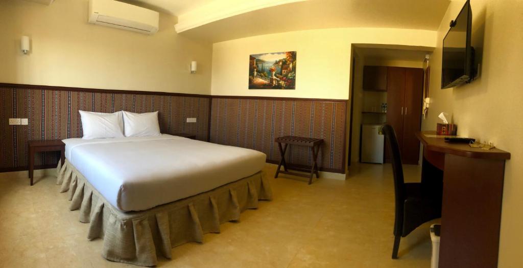 Una cama o camas en una habitación de Turtle Beach Resort