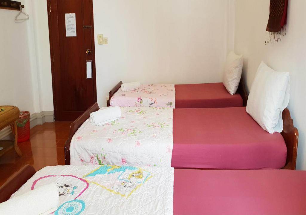 Postel nebo postele na pokoji v ubytování Smiley's Guesthouse