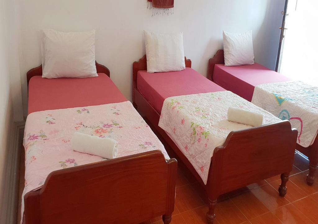 Postel nebo postele na pokoji v ubytování Smiley's Guesthouse