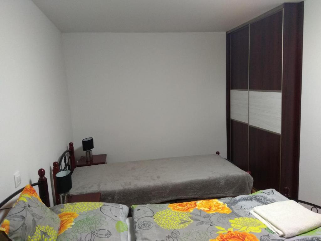 A bed or beds in a room at Apartmány Danka