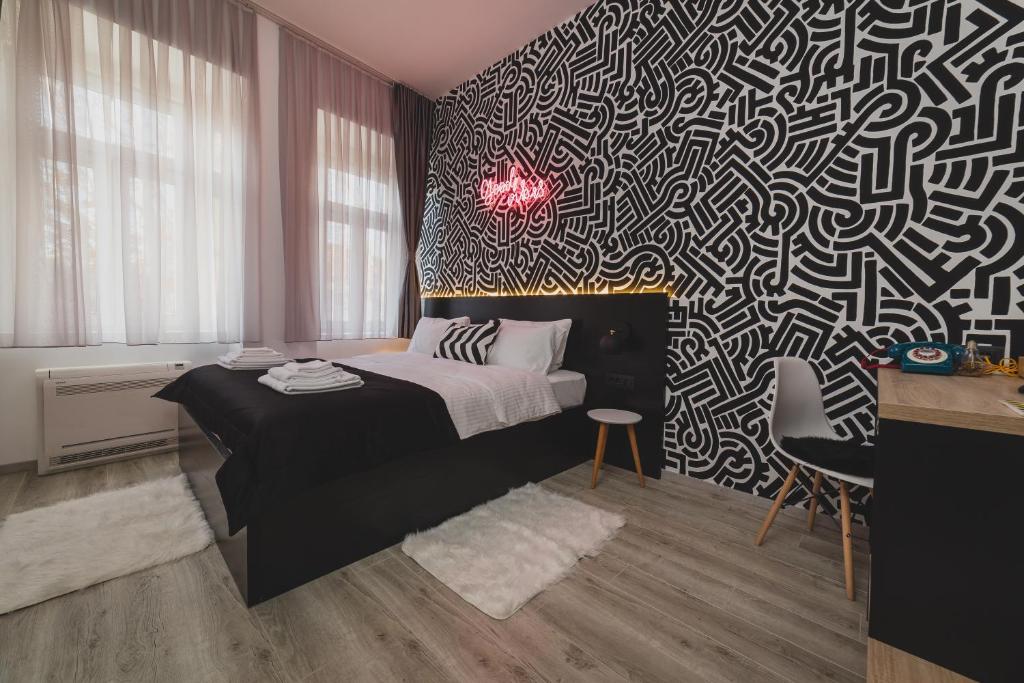 Postel nebo postele na pokoji v ubytování Hotel Marienplatz Podgorica