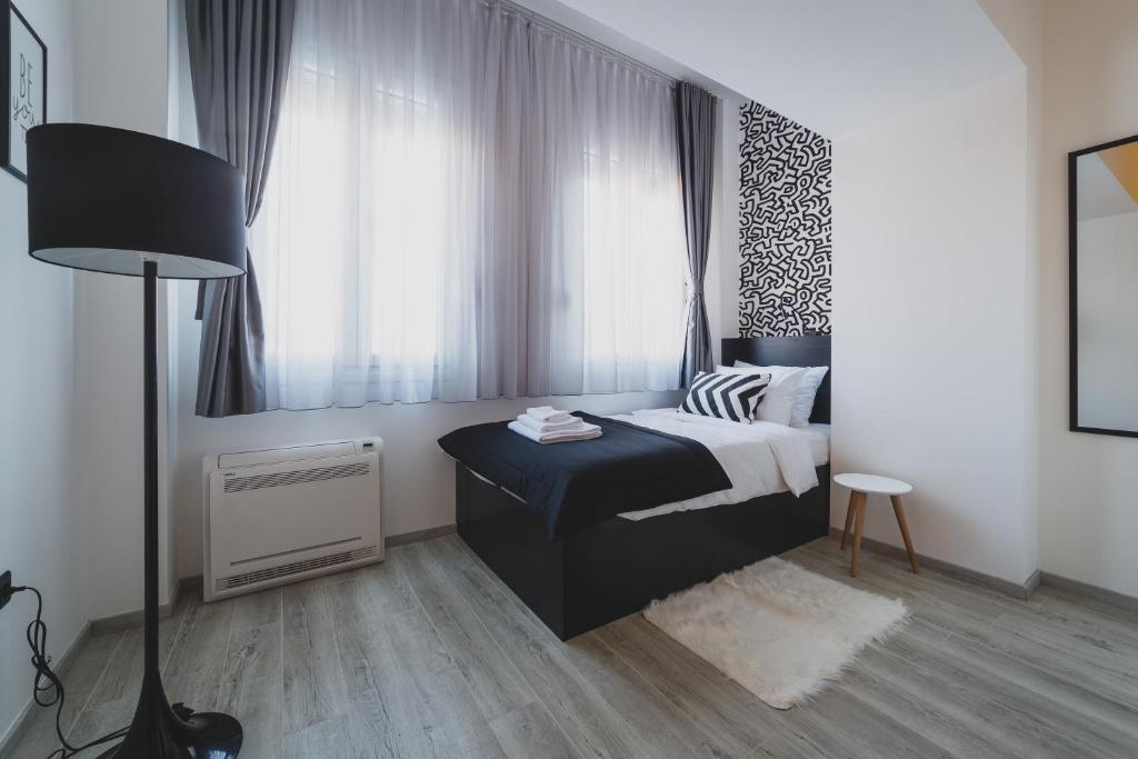 Postel nebo postele na pokoji v ubytování Hotel Marienplatz Podgorica
