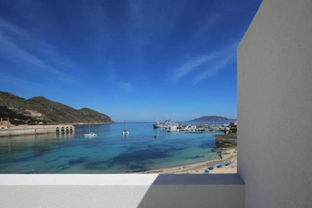 a view of a body of water with boats in it at La Praya in Favignana
