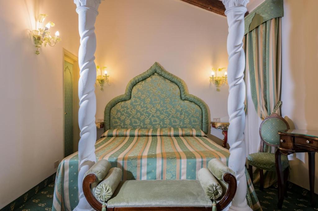 Postel nebo postele na pokoji v ubytování Hotel Giorgione