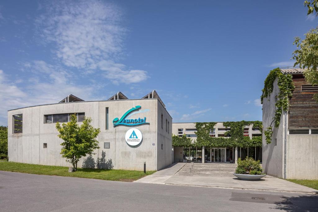 a building with a sign on the front of it at Lausanne Youth Hostel Jeunotel in Lausanne