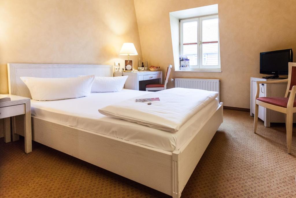 Postel nebo postele na pokoji v ubytování martas Hotel Albrechtshof Berlin