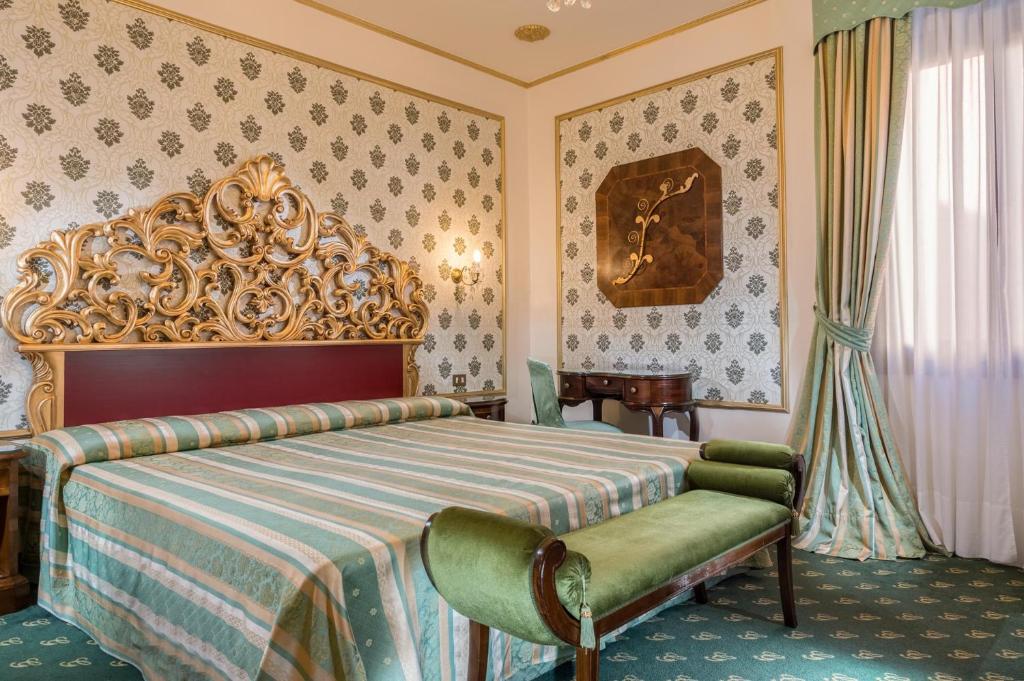 Postel nebo postele na pokoji v ubytování Hotel Giorgione