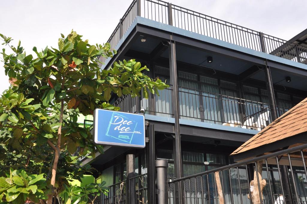 a blue sign in front of a building at Dee Dee Sea Front in Phi Phi Don