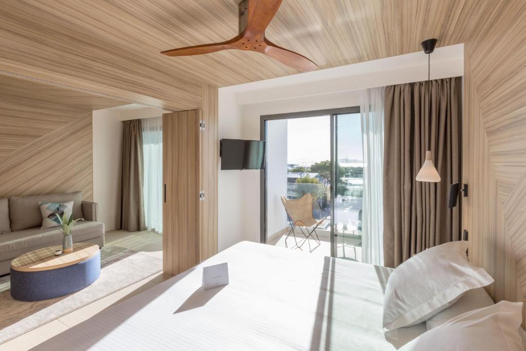 A bed or beds in a room at Bordoy Alcudia Port Suites - Adults Only