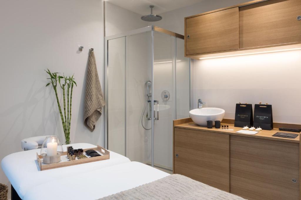 A bed or beds in a room at Bordoy Alcudia Port Suites - Adults Only