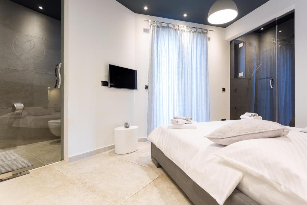 Posteľ alebo postele v izbe v ubytovaní New Apartment ParkView/CityView