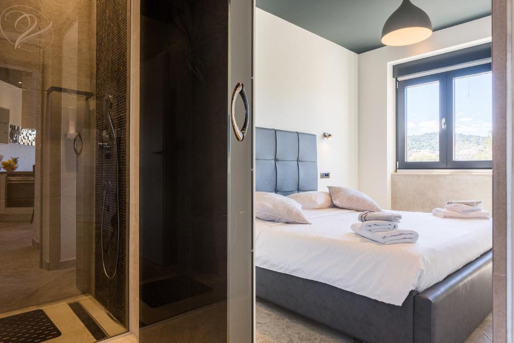 Posteľ alebo postele v izbe v ubytovaní New Apartment ParkView/CityView