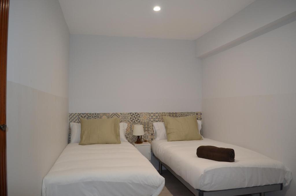 Postel nebo postele na pokoji v ubytování Poble Sec Apartments