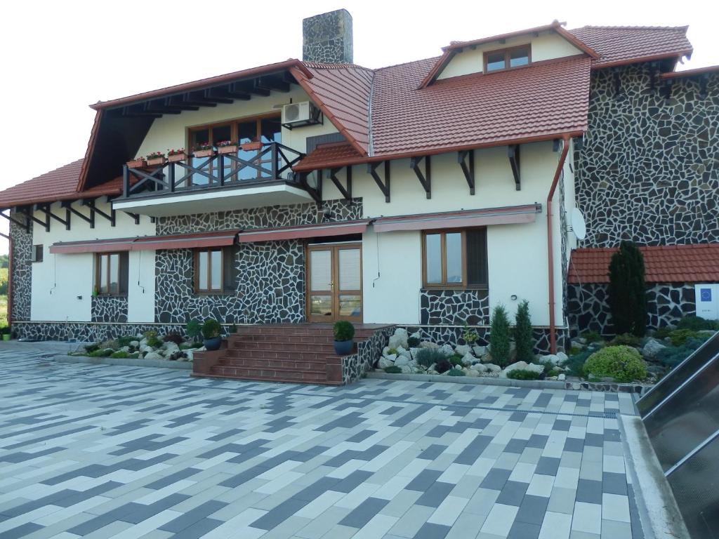 a house with a red roof at Penzión Vínny Dom in Streda nad Bodrogom