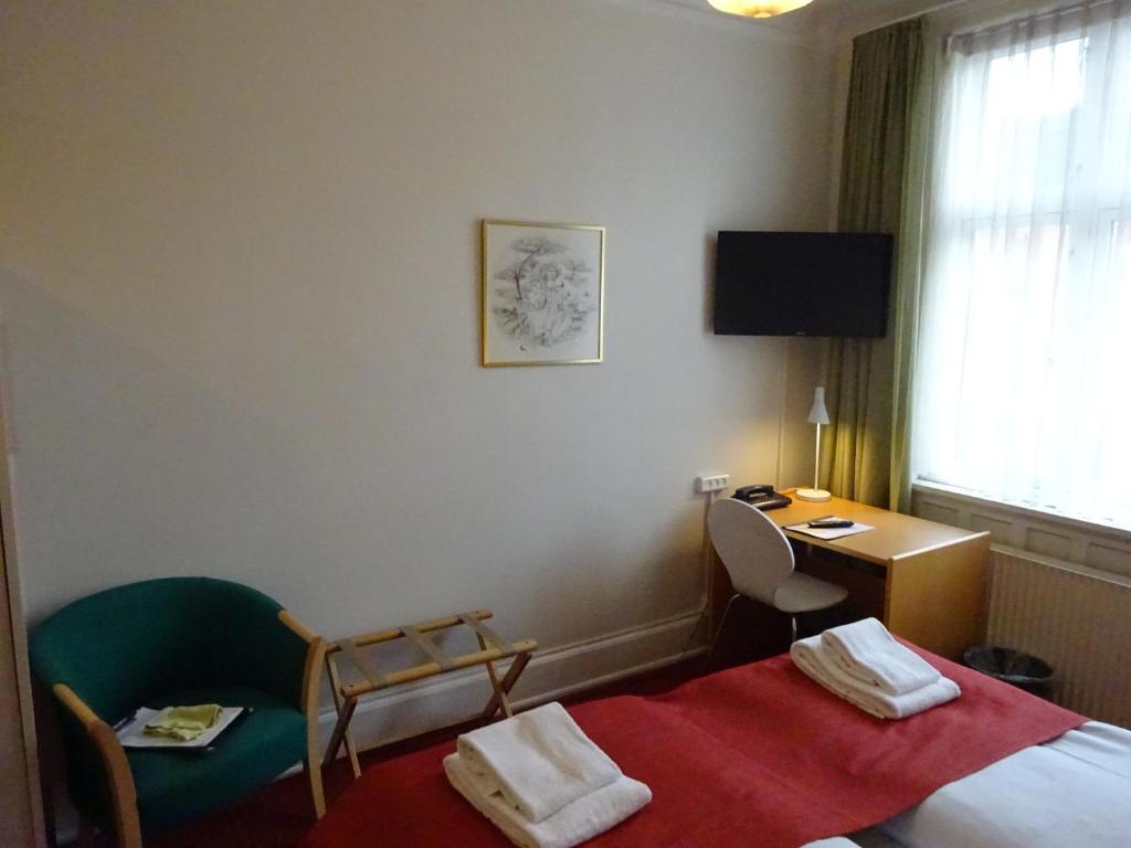 Postel nebo postele na pokoji v ubytování City Hotel Nebo