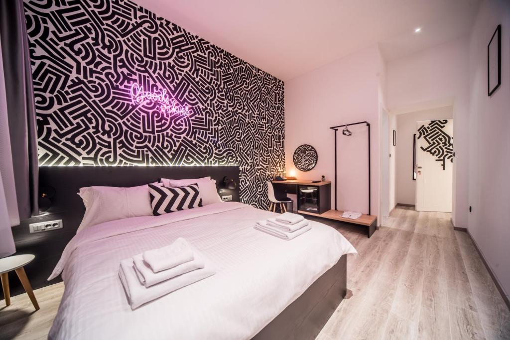 Postel nebo postele na pokoji v ubytování Hotel Marienplatz Podgorica