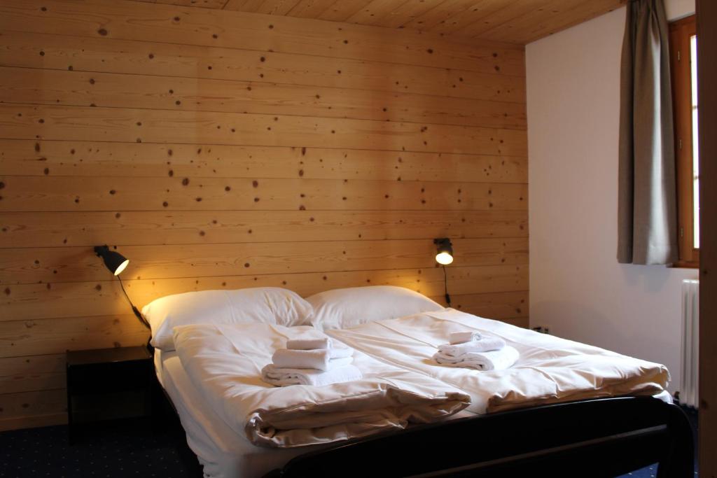 Postel nebo postele na pokoji v ubytování Hotel Wynegg