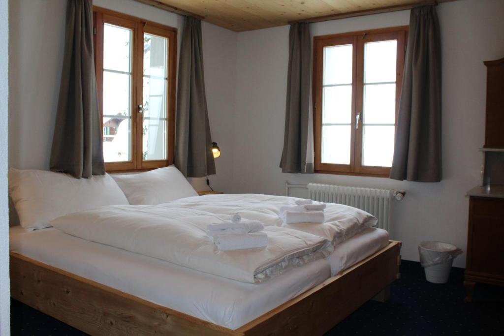 Postel nebo postele na pokoji v ubytování Hotel Wynegg