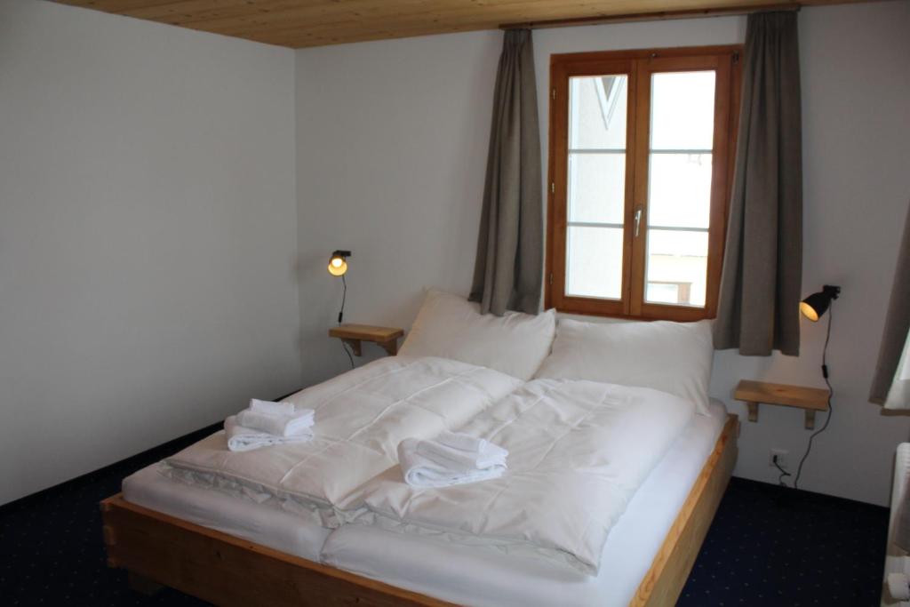 Postel nebo postele na pokoji v ubytování Hotel Wynegg