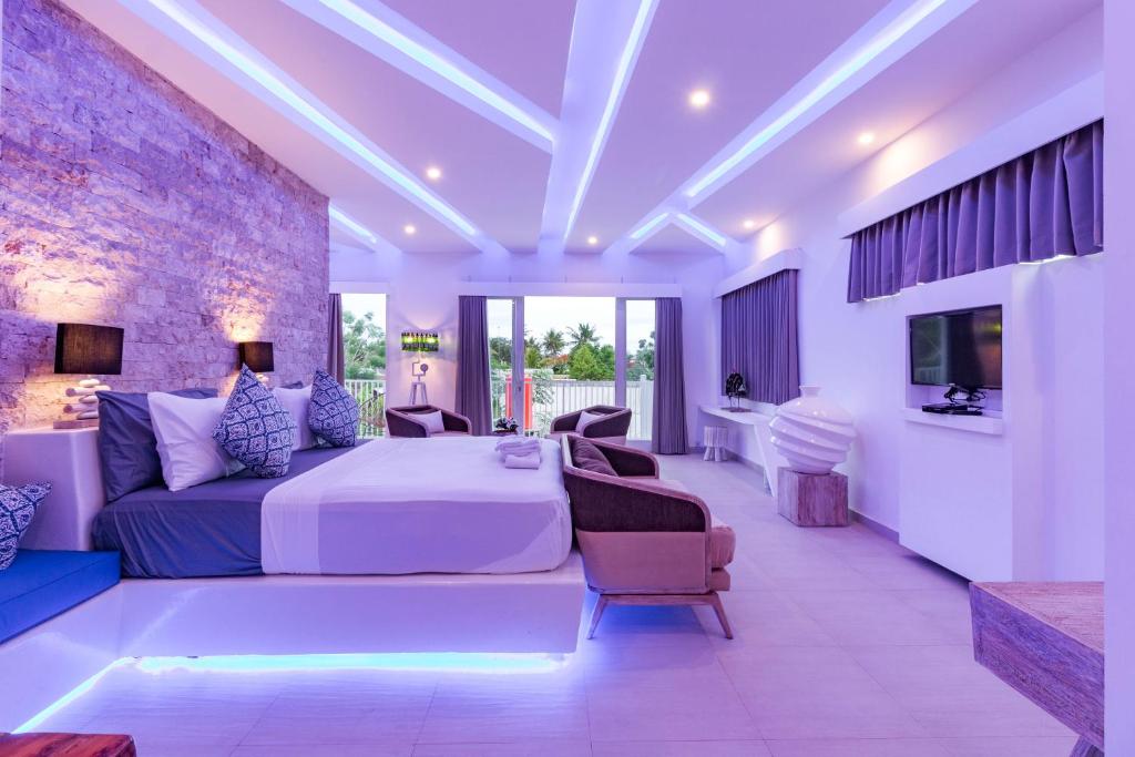 Postel nebo postele na pokoji v ubytování Cocotoa Boutique Hotel & Villa