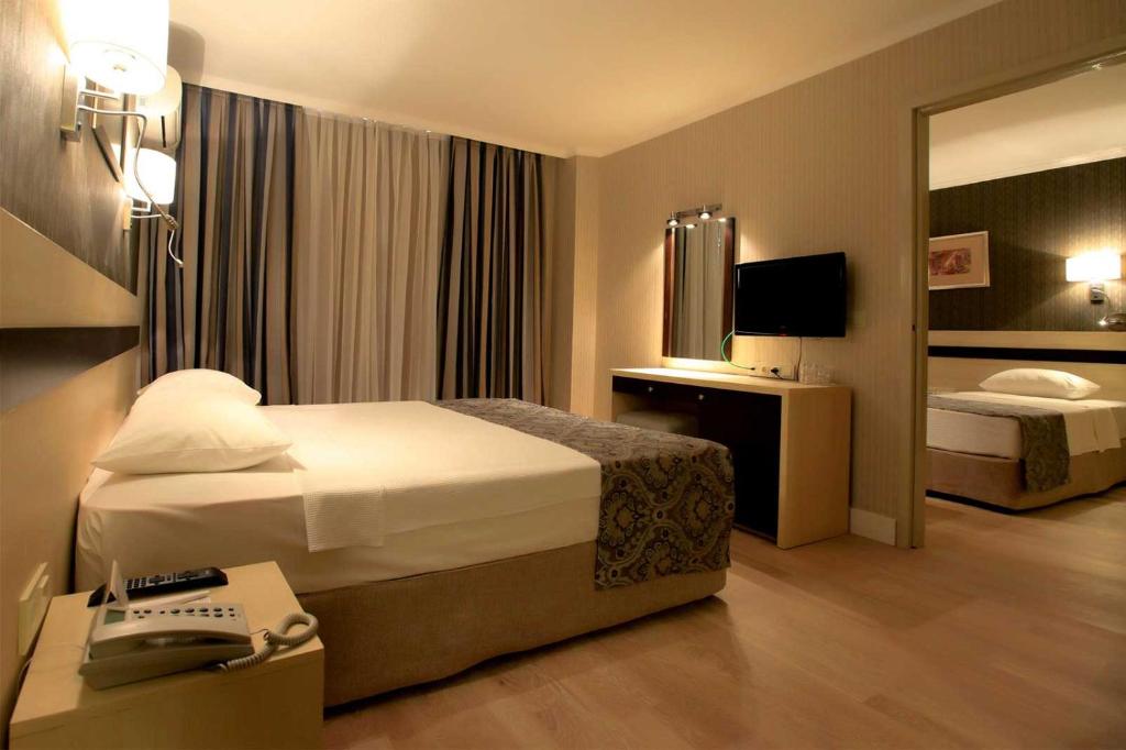 Postel nebo postele na pokoji v ubytování A11 Hotel Obaköy