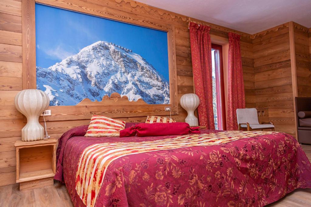 Postel nebo postele na pokoji v ubytování Hotel Chaberton