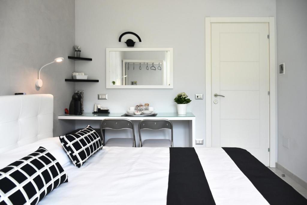 Postel nebo postele na pokoji v ubytování Costantino Suites
