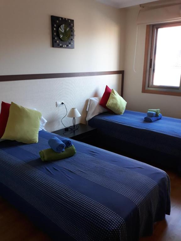 Posteľ alebo postele v izbe v ubytovaní Piso de 3 Dormitorios en Noalla (Sanxenxo)