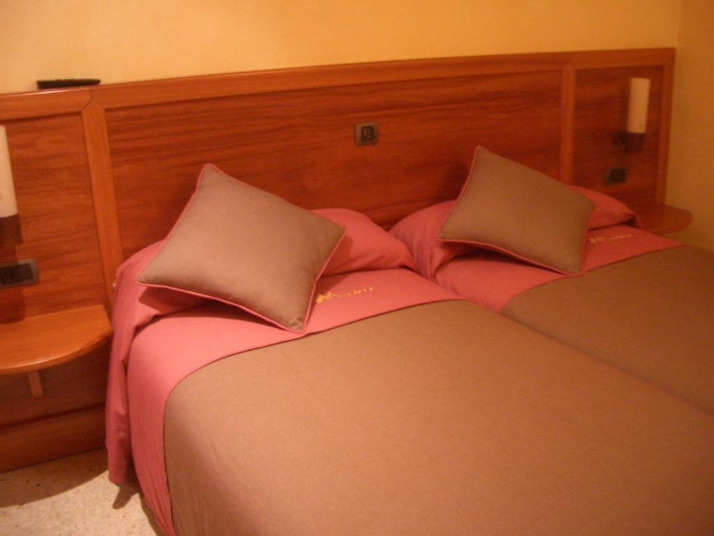 Postel nebo postele na pokoji v ubytování Hostal Montaña