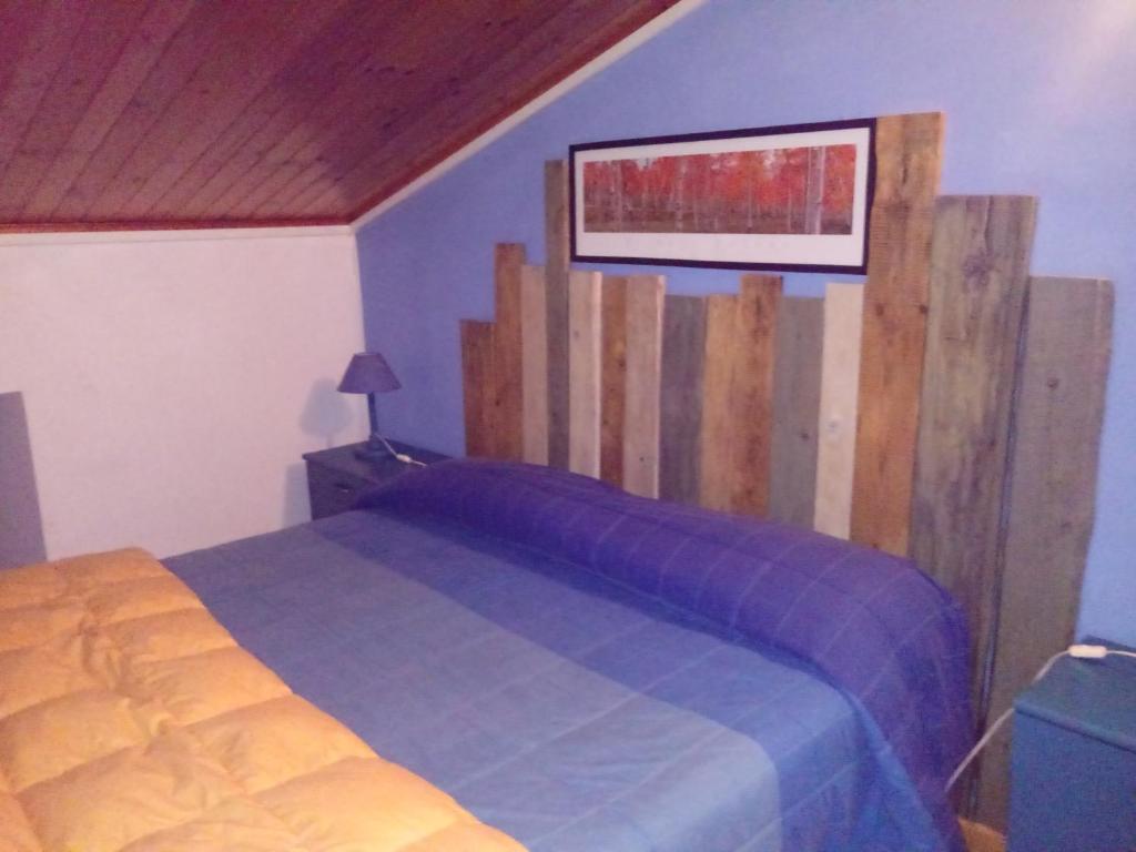 Postel nebo postele na pokoji v ubytování Il rifugio nel parco