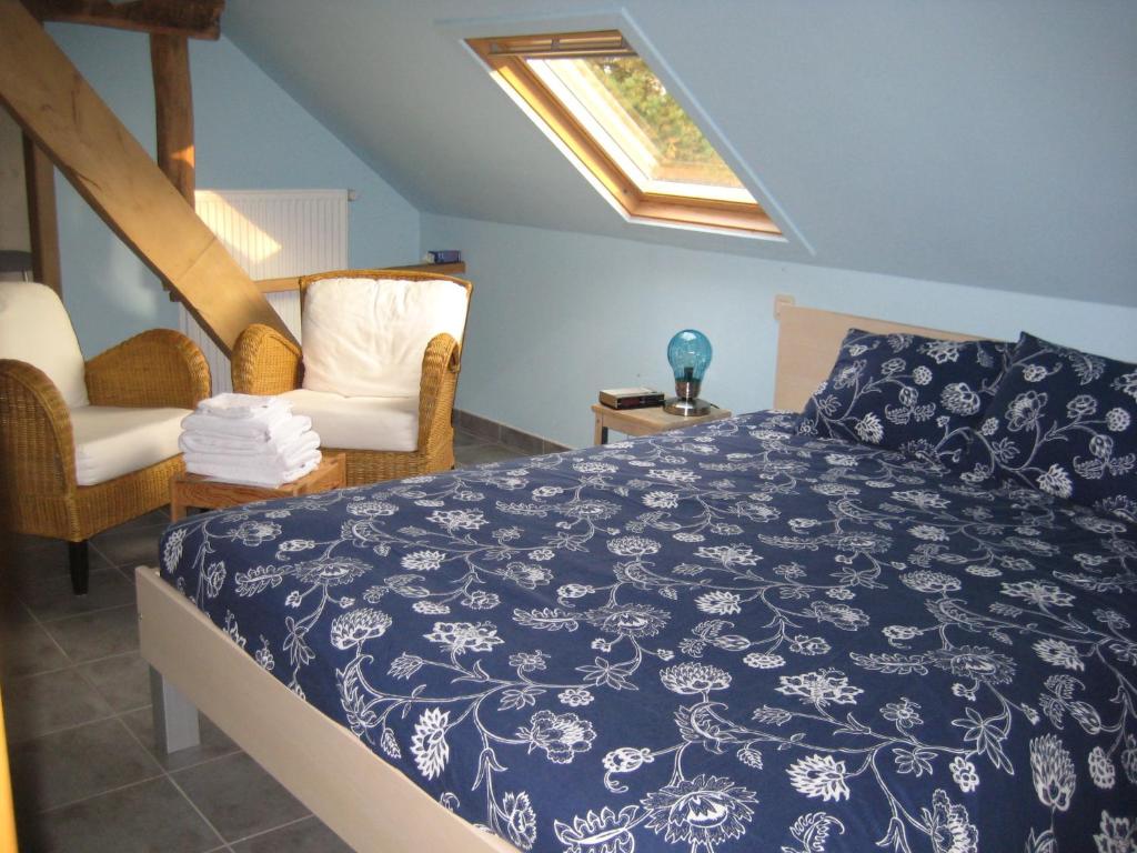 Postel nebo postele na pokoji v ubytování B&B Het Uilennest