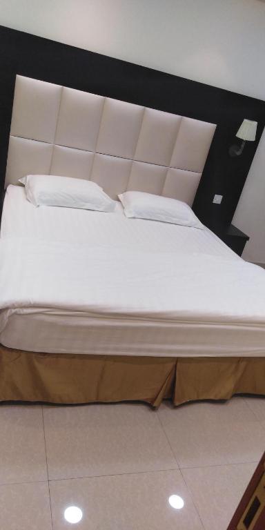 Postel nebo postele na pokoji v ubytování روح الأصيلة للشقق المخدومة Roh Alaseilah Serviced Apartments