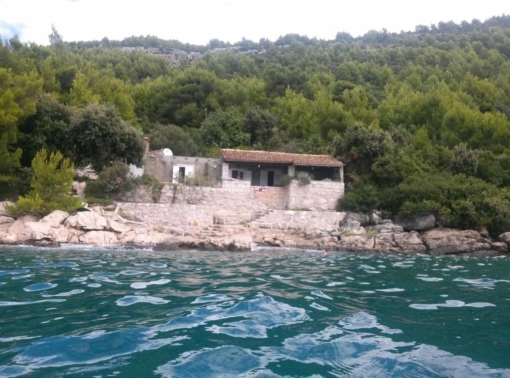 a house on the banks of a river at Holiday Home Ratac Sunshine Beach in Slano
