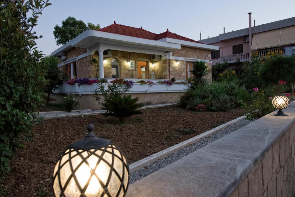 a house with a light in the front yard at Harmony House in Kissamos