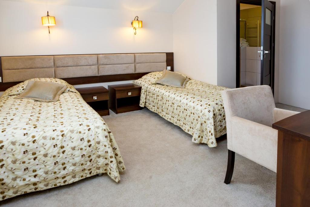 Posteľ alebo postele v izbe v ubytovaní Hotel Alexandra
