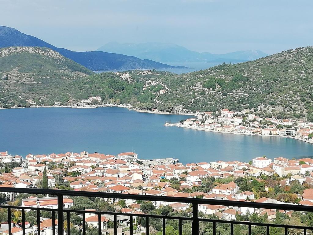 a view of a town and a body of water at Calypso Apartments in Vathi